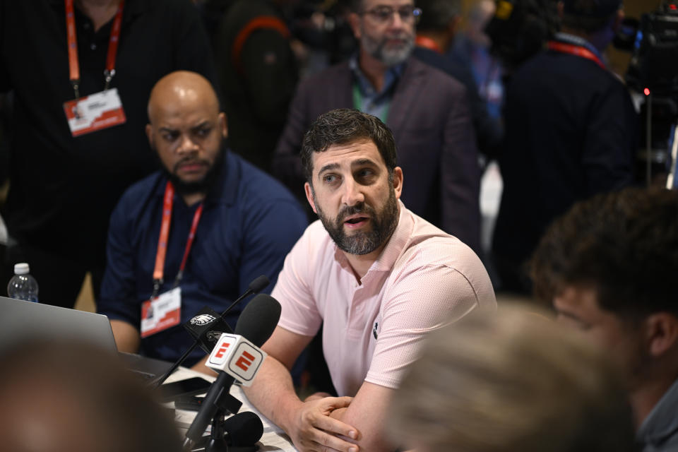 Philadelphia Eagles head football coach Nick Sirianni, center, talks with reporters during an NFC coaches availability at the NFL football owners meetings, Tuesday, March 26, 2024, in Orlando, Fla. (AP Photo/Phelan M. Ebenhack)