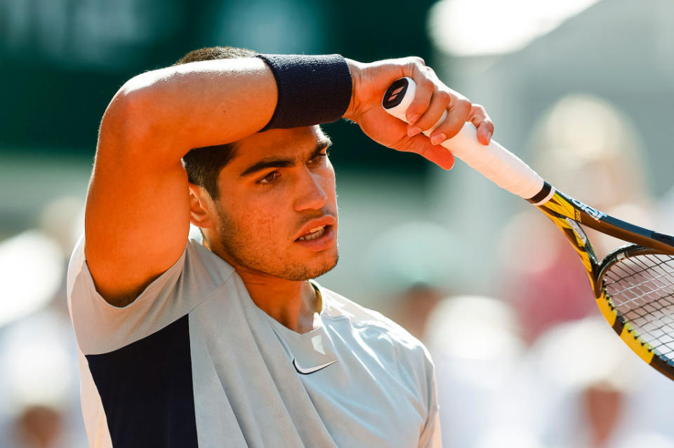 Carlos Alcaraz of Spain reacts during his match against Alexander Zverev of Germany during the Men's Singles Quarter Finals match on Day 10 of the 2022 French Open at Roland-Garros on May 31, 2022 in Paris, France.<span class="copyright">Antonio Borga/Eurasia Sport Images/Getty Images</span>