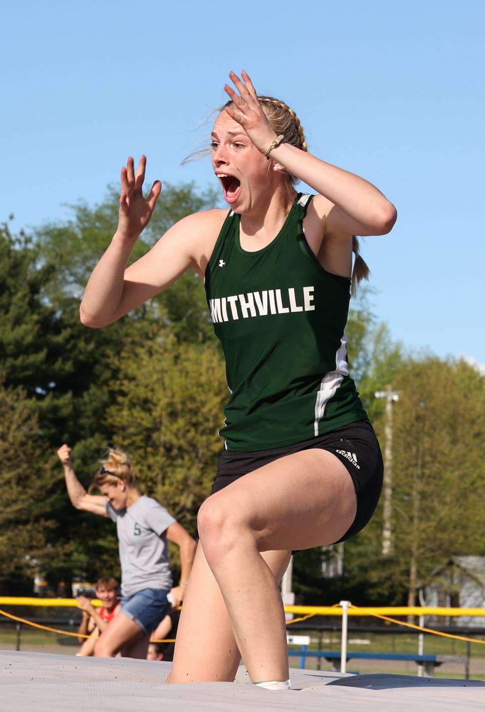 Smithville's Abby Hartzler is beyond excited after clearing 5-4.25 to break school record of 5-4 set in 1983 and matched in 2017 by Taylor McCanna.