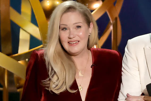 <p>Kevin Winter/Getty </p> Christina Applegate speaking onstage at the 75th Primetime Emmy Awards