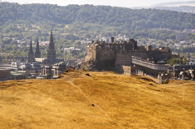 Large areas of grass have turned yellow due to the dry conditions in Holyrood Park, Edinburgh (Jane Barlow/PA)