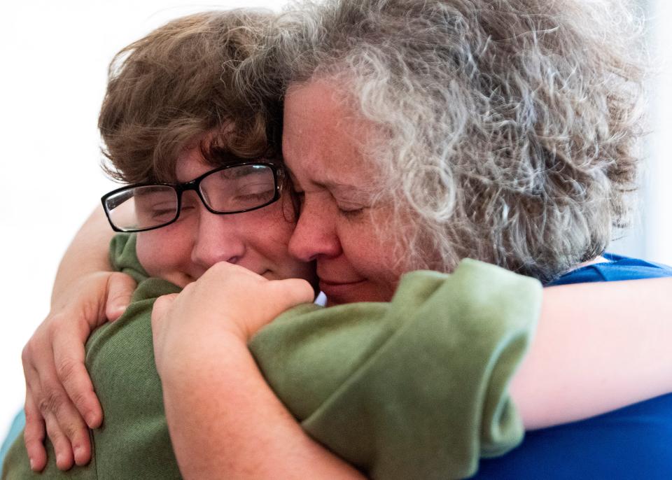 Cardelia Howell-Diamond poses hugs her trans son Kai at their home in Alabama on Friday April 29, 2022. 