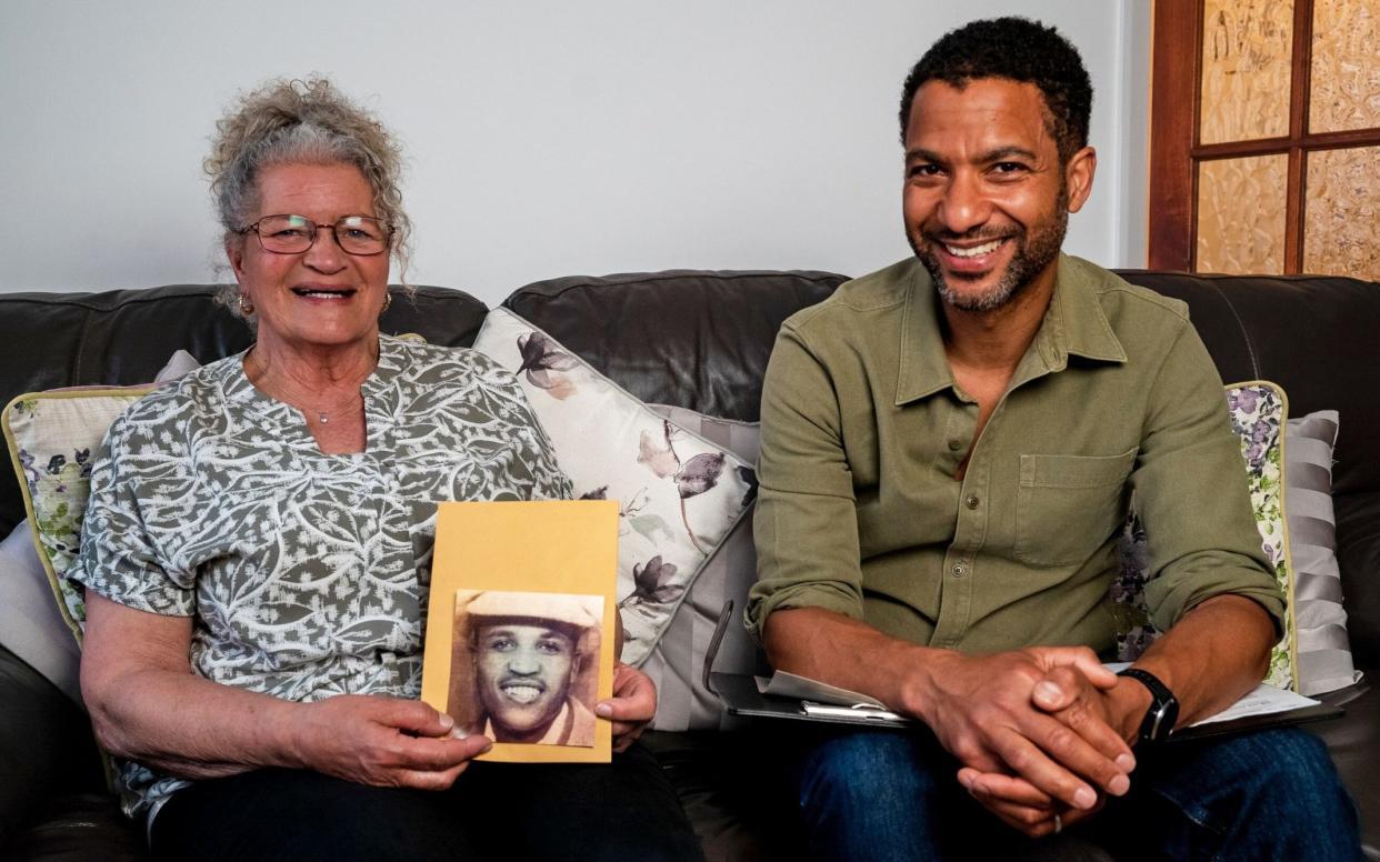 Presenter Sean Fletcher with Mary Phillips holding a photo of her father - Channel 4