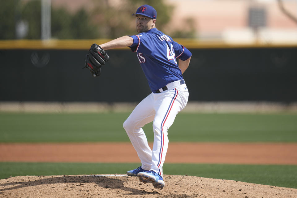 Texas Rangers starting pitcher Jacob deGrom delivers during the second inning of a AA baseball rehabilitation start with the Frisco RoughRiders against the Northwest Arkansas Naturals, Monday, March 13, 2023, in Surprise, Ariz. (AP Photo/Abbie Parr)