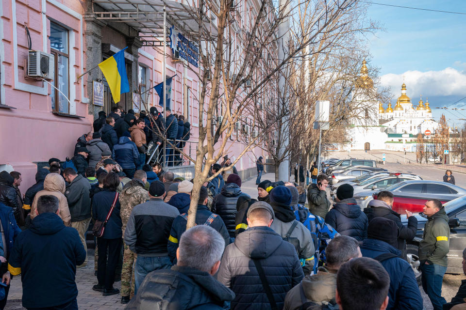 Men line up to join Kyiv’s Territorial Defense Forces on Feb. 26.<span class="copyright">Alex Lourie—Redux</span>