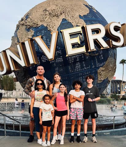 <p>Kim Marie Kessler Instagram</p> Randy Orton with his wife, Kim Marie Kessler, and their kids at Universal Studios in 2023.