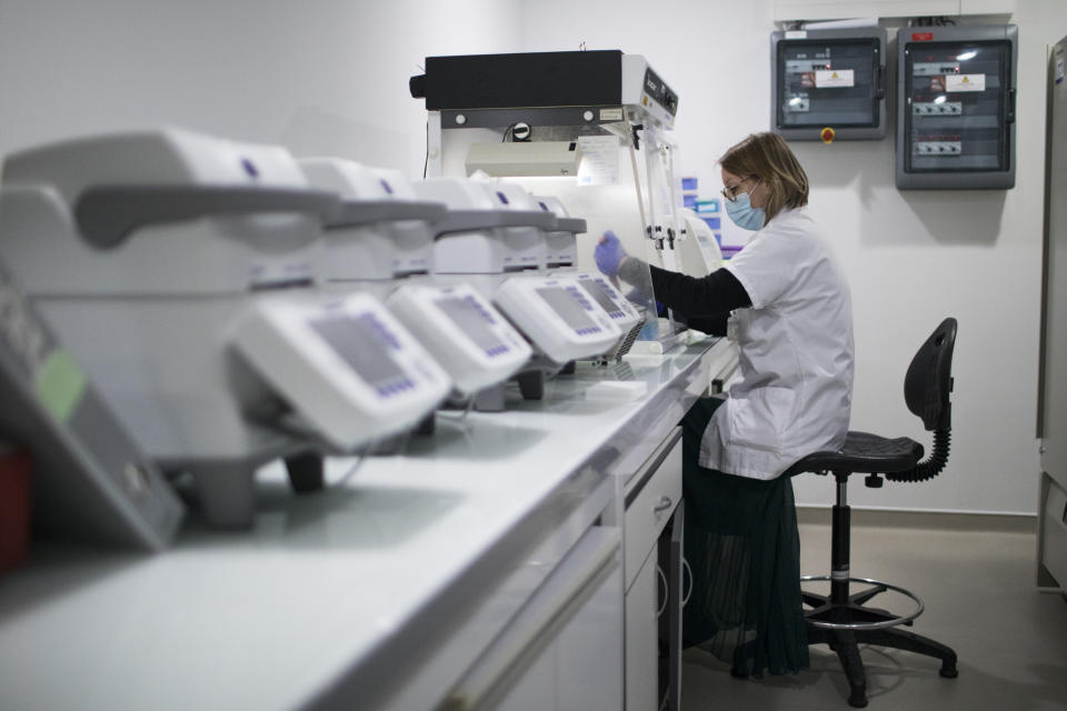 FILE - In this Wednesday Jan. 13, 2021 file photo, microbiologist Marielle Bedotto-Buffet prepares samples at the University Hospital Institute for Infectious Diseases in Marseille, southern France, to study the highly contagious COVID-19 variant that has been discovered in the UK. Europe recorded 1 million new COVID-19 cases last week, an increase of 9% from the previous week and ending a six-week decline, WHO said Thursday, March 4, 2021. The so-called UK variant is of greatest concern in the 53 countries monitored by WHO in Europe. (AP Photo/Daniel Cole, File)