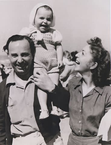 <p>Courtesy Diane von Furstenberg Archive</p> Diane with parents Leon and Liliane Halfin in 1948.