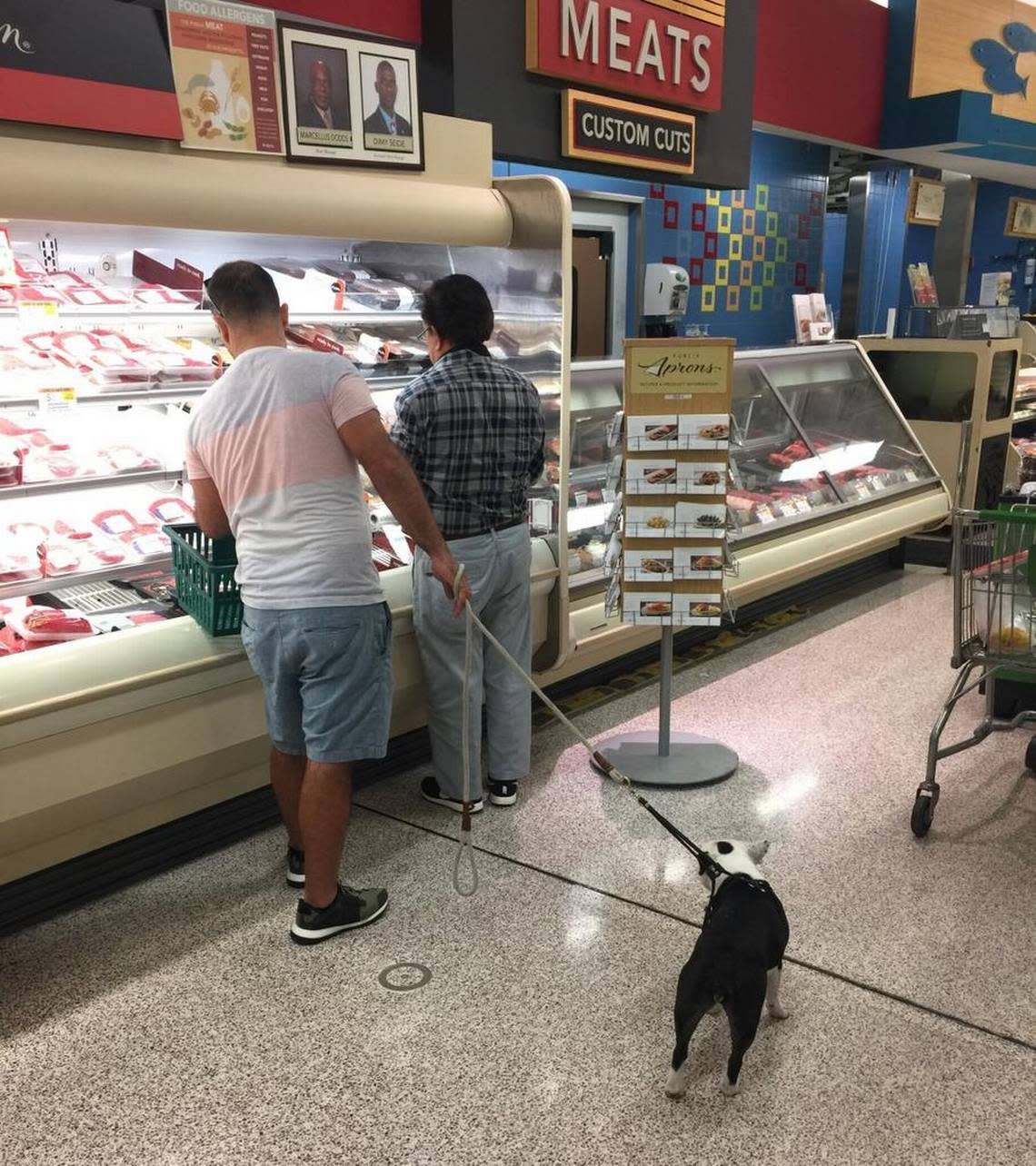 Shoppers and their dog on Jan. 3, 2017, at Publix on Biscayne Boulevard north of downtown Miami. Unless dogs are true service animals they are forbidden inside Publix supermarkets according to corporate policy. The rule includes not permitting emotional support animals inside stores.
