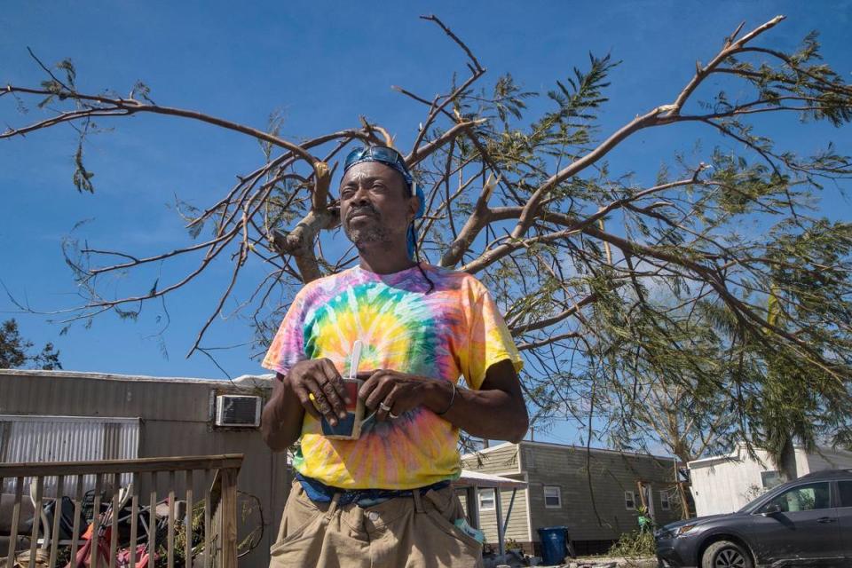 Shawn Hunte, a resident at Sunnyland Court Mobile Home Park in San Carlos Island, talks about his ordeal to survive in the tree behind him as Hurricane Ian hit Florida’s west coast as a Category 4 storm on Sept. 28, 2022.