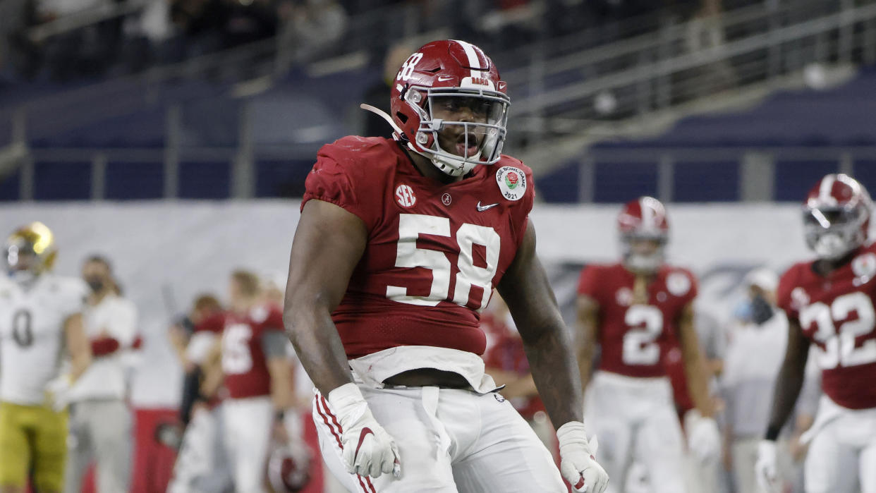 Alabama defensive lineman Christian Barmore (58) celebrates a sack against Notre Dame during the Rose Bowl NCAA college football game in Arlington, Texas, Friday, Jan. 1, 2021. (AP Photo/Michael Ainsworth)