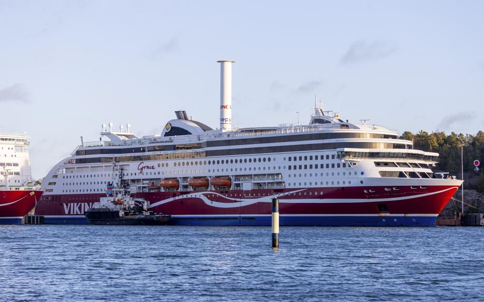 The passenger ferry Viking Grace is seen at the port of Mariehamn, Aland Islands, Finland, Sunday, Nov. 22, 2020. A Baltic Sea ferry with 331 passengers and a crew of 98 has run aground in the Aland Islands between Finland and Sweden amid heavy storm winds. Finnish authorities say there are “no lives in immediate danger” and the vessel isn’t leaking. The Finnish coast guard tweeted Saturday afternoon that the Viking Grace hit ground just off the port of Mariehamn, the capital of the archipelago. (Niclas Norlund/Lehtikuva via AP)