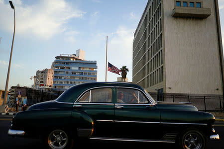 A vintage car passes by the U.S. Embassy in Havana, Cuba, April 19, 2018. REUTERS/Alexandre Meneghini
