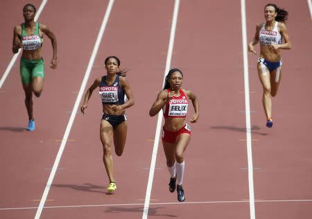 Allyson Felix of U.S. (2nd R) wins the women's 400 metres heats during the 15th IAAF World Championships at the National Stadium in Beijing, China August 24, 2015. REUTERS/David Gray