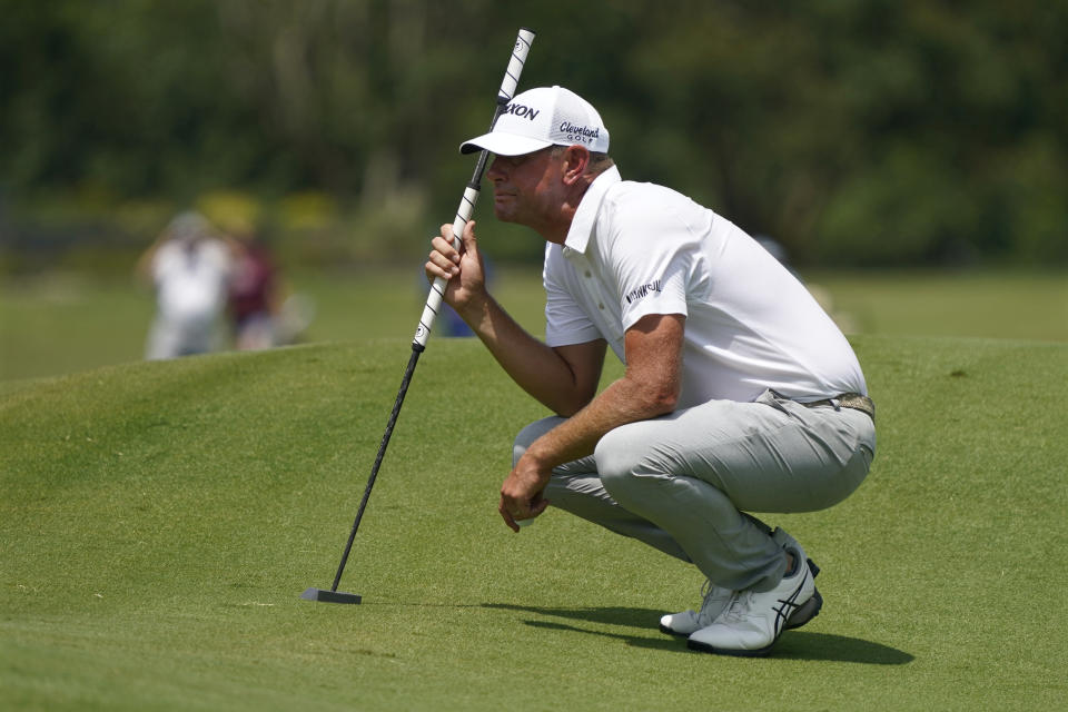 Lucas Glover lines up a putt on the first hole during the final round of the Wyndham Championship golf tournament in Greensboro, N.C., Sunday, Aug. 6, 2023. (AP Photo/Chuck Burton)