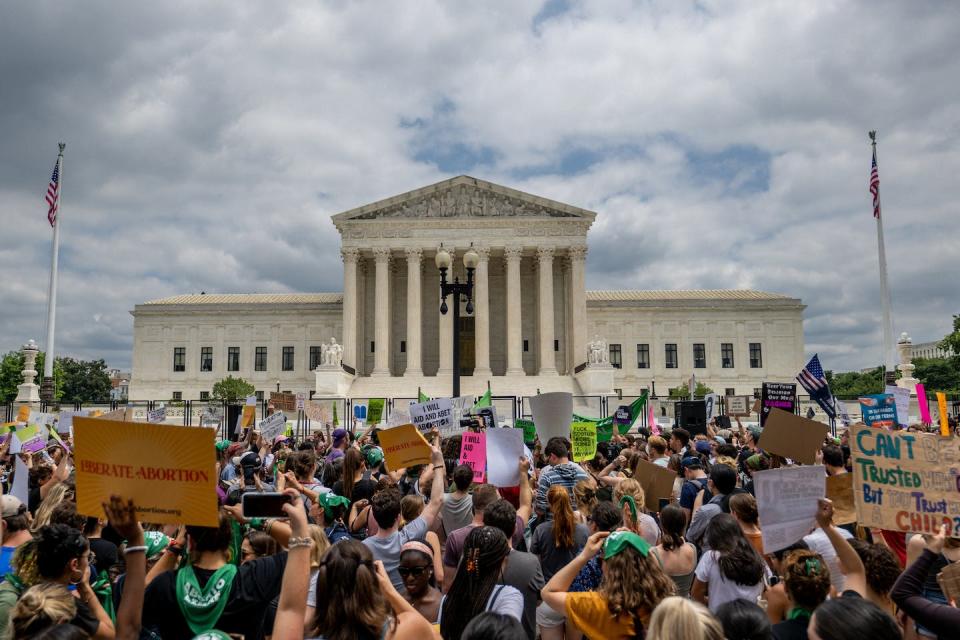 People protest in response to the Dobbs v. Jackson ruling outside the Supreme Court Building on June 24, 2022. <a href="https://media.gettyimages.com/photos/people-protest-in-response-to-the-dobbs-v-jackson-womens-health-in-picture-id1404906099" rel="nofollow noopener" target="_blank" data-ylk="slk:Brandon Bell/Getty Image;elm:context_link;itc:0;sec:content-canvas" class="link ">Brandon Bell/Getty Image</a>