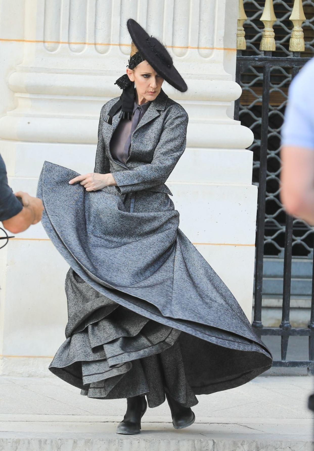 ** RIGHTS: ONLY UNITED STATES, CANADA ** Paris, FRANCE  - Singer Celine Dion is spotted dancing during a video shoot for Vogue in the garden of the Palais Royal in Paris, France. Celine was wearing a turn of the century grey dress with a wide brim black hat.Pictured: Celine DionBACKGRID USA 6 JULY 2017 BYLINE MUST READ: Best Image / BACKGRIDUSA: +1 310 798 9111 / usasales@backgrid.comUK: +44 208 344 2007 / uksales@backgrid.com*UK Clients - Pictures Containing ChildrenPlease Pixelate Face Prior To Publication*