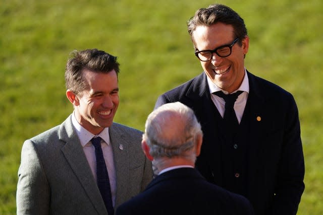 Ryan Reynolds, right, and Rob McElhenney, left, talk with Charles