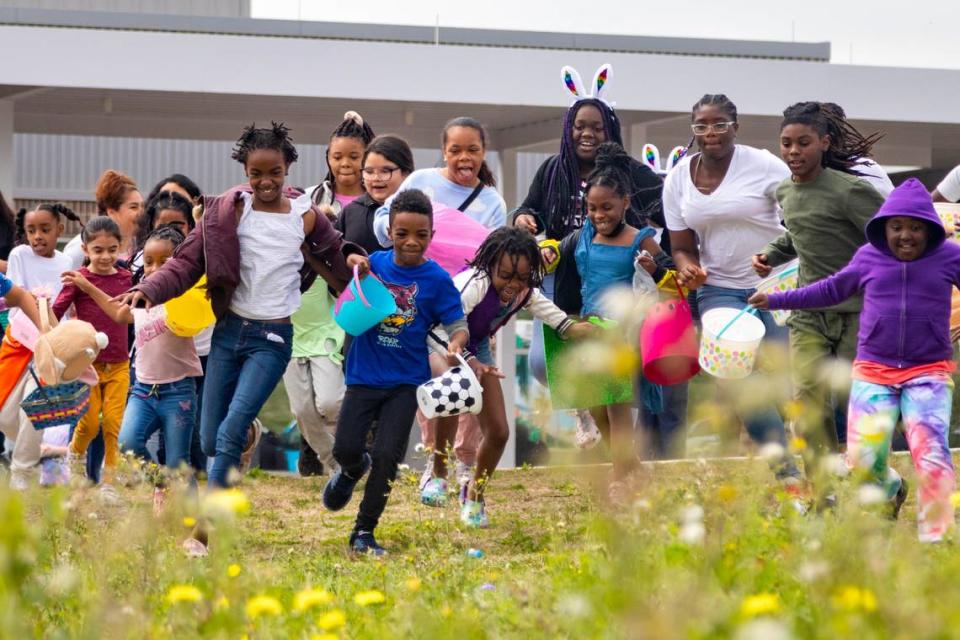 Kids surge forward as the annual Easter egg hunt begins at the Como Community Center in Fort Worth on Saturday, April 8, 2023.