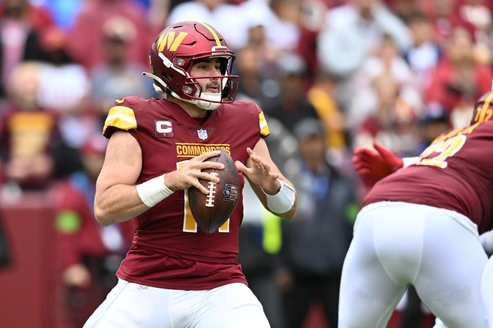 Sam Howell #14 of the Washington Commanders looks to pass during the second quarter of a game against the Buffalo Bills at FedExField on September 24, 2023 in Landover, Maryland.