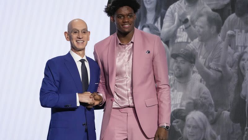 Taylor Hendricks poses for a photo with NBA Commissioner Adam Silver after being selected ninth overall by the Utah Jazz During the NBA basketball draft, Thursday, June 22, 2023, in New York. (AP Photo/John Minchillo)