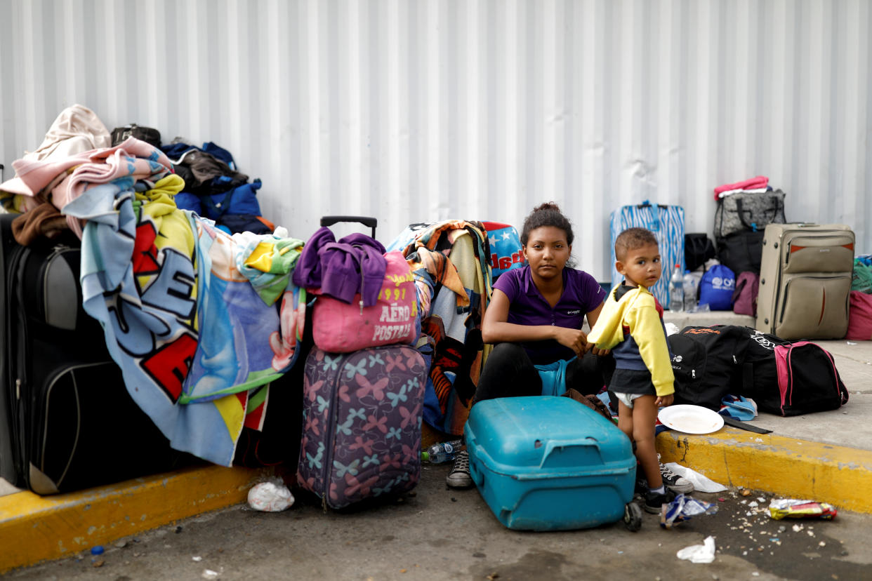 Venezuelan migrant Juviamdy Garcia, 19, poses for a picture with her son Luian, 2, after having processed their documents at the Ecuadorian-Peruvian border service centre, before they continue their journey, on the outskirts of Tumbes, Peru, June 17, 2019. Garcia, a paramedic, is travelling with her son to reunite with her husband who has been living in Peru for a year. "We arrived in San Antonio (in Venezuela) on Monday, and (the guide) helped us cross (the border) using the pathways. When we got to the other side, the Colombian police stopped us and made us return, we had to go back to the river, but that time just with the children, because nobody helped us to return." After a week travelling, "I only have $20 left to get to where I'm going, because I have to go to Lima, but I don't know how far I can get," Garcia said. "My son has been sick; I had to take him to the doctor. He has been under treatment because he has amoebiasis; he had diarrhoea and blood in his stools." "I want to be in my country, my dream is to be a doctor, I studied at the university, but I had to leave because I got pregnant and also because I had a terrible experience. I was in a classroom, and suddenly some men entered with guns, and they robbed us all, they (assaulted) a woman classmate and beat others." "I said to my mother, I didn't want to go there anymore." REUTERS/Carlos Garcia Rawlins    SEARCH "MOTHERS REFUGEE" FOR THIS STORY. SEARCH "WIDER IMAGE" FOR ALL STORIES.
