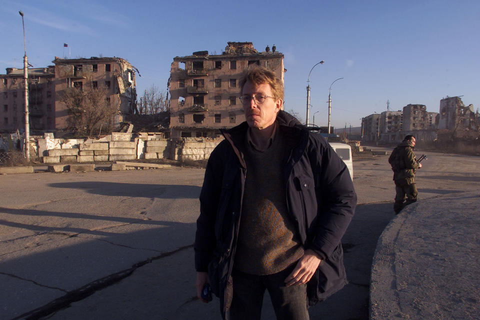 Associated Press newsman Jim Heintz stands in war-ruined Minutka Square in the Chechen capital of Grozny, Russia, in February 2004. Heintz was posted in Moscow in 1999 and remained there for almost all of Russian President Vladimir Putin’s rule until earlier this year, watching the country’s steps forward as well as its retreat into isolation. Now assigned to Tallinn, Estonia, he tries to parse Russia’s lost promise. (AP Photo/Ivan Sekretarev)