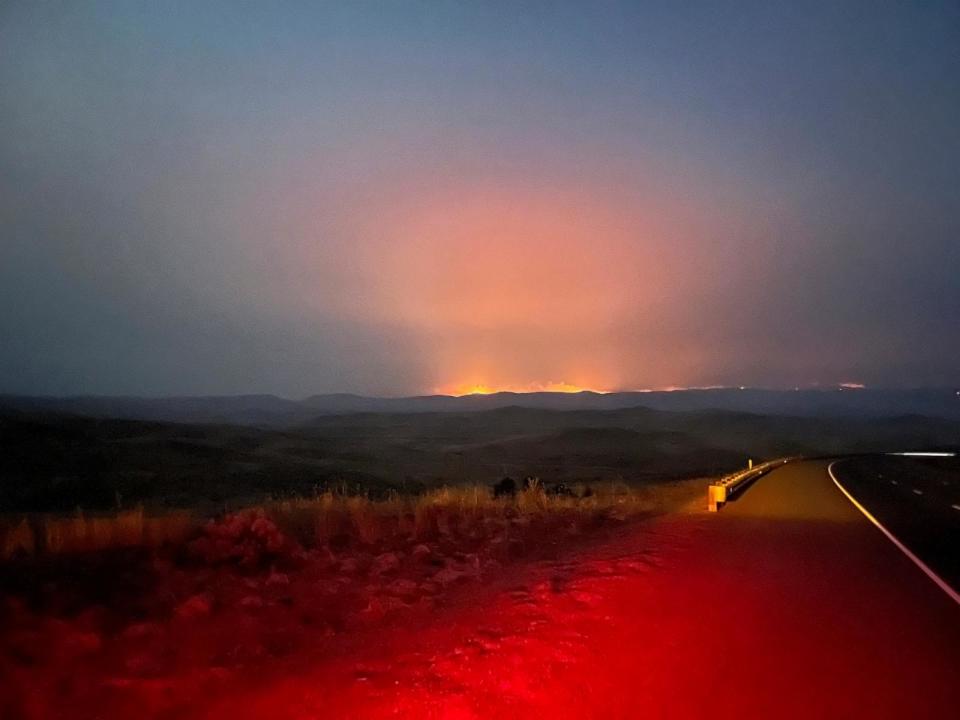 PHOTO: In this image provided by the Oregon Department of Transportation, the Durkee fire burns in the background as it nears Interstate 84 near Huntington, Ore., July 21, 2024. (Oregon Department of Transportation via AP)