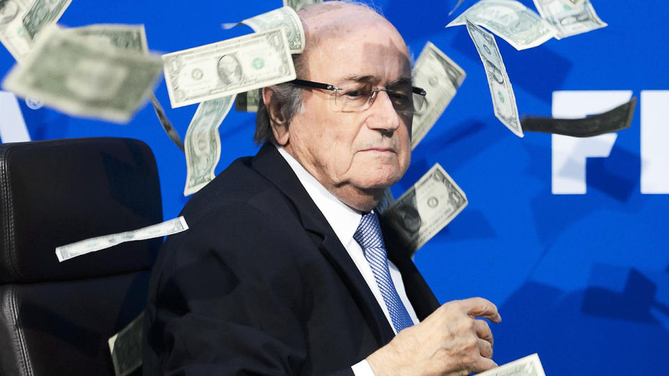 Former FIFA boss Sepp Blatter is pictured at a press conference which was interrupted when a man threw bundles of cash in the air.