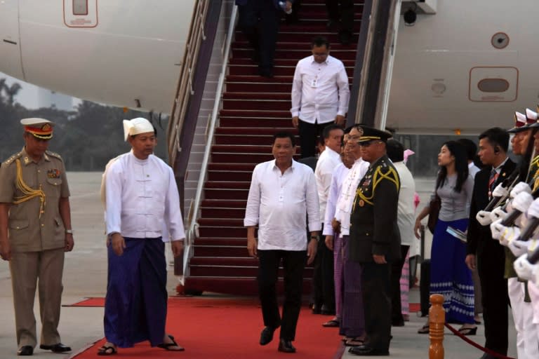 Philippine President Rodrigo Duterte (C) arrives at Naypyidaw International Airport on a four-day official visit to Myanmar and Thailand, on March 19, 2017