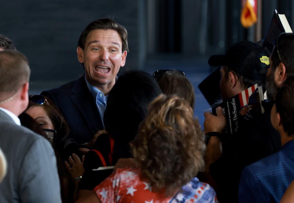 Florida Gov. Ron DeSantis enthusiastically meets supporters. 