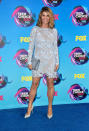 <p>Major legs and lace from the ageless <i>Fuller House</i> star, who accessorized her sweet dress with a studded clutch to add a touch of edge. (Photo: Getty Images) </p>