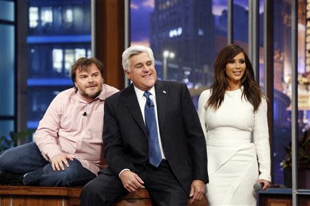 Jay Leno sits with guests Jack Black and Kim Kardashian on his final night hosting "The Tonight Show with Jay Leno" in Burbank, California in this February 6, 2014 picture provided by NBC. REUTERS/Stacie McChesney/NBC/Handout via Reuters