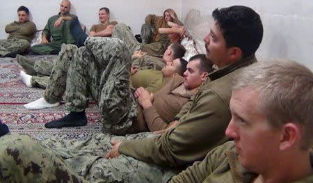 U.S. sailors are seen in an undisclosed location in Iran in this handout picture released on Farsnews website on January 13, 2016. REUTERS/farsnews.com/Handout via Reuters