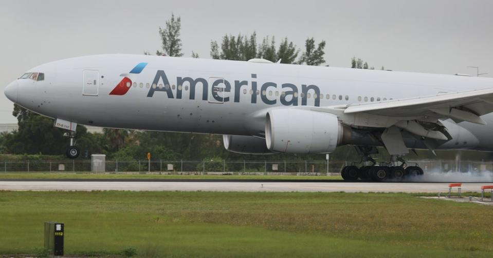 An American Airlines plane lands at the Miami International Airport (Joe Raedle/ Getty Images)