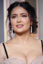 <p> Polished updos were definitely on trend, but in the '60s and into '70s hairstyles territory, undone and slightly "lived in" styles were also extremely popular, like this low and slightly wispy style seen on actress Salma Hayek. </p>