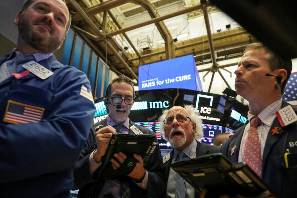 Traders work on the floor of the New York Stock Exchange (NYSE) in New York, U.S., January 10, 2019. REUTERS/Brendan McDermid