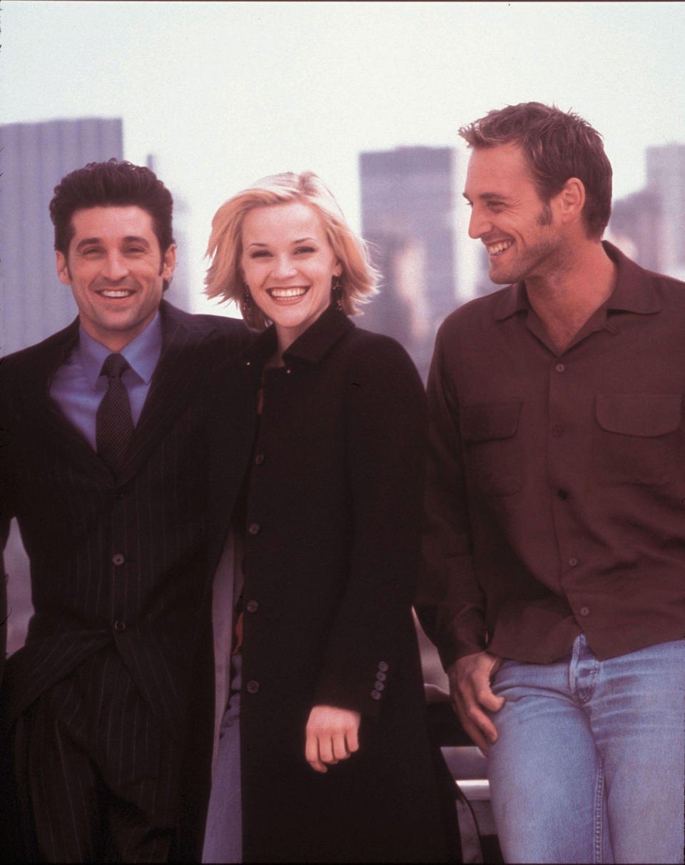 Dempsey, Witherspoon and Lucas stand smiling against the NYC skyline. (Touchstone Pictures / Alamy Stock Photo)