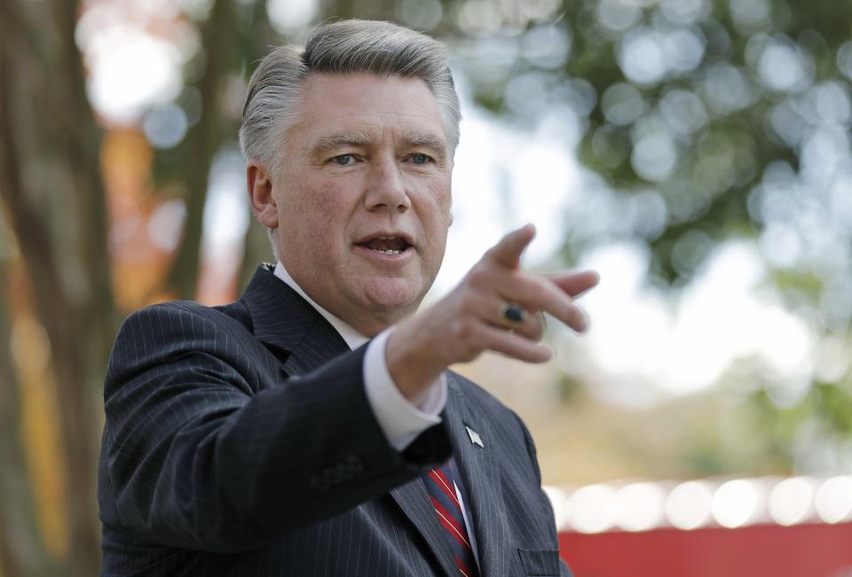 FILE - In this Nov. 7, 2018, file photo, Mark Harris speaks to the media during a news conference in Matthews, N.C. The nation's last unresolved fall congressional race with Harris against Democrat Dan McCready is awash in doubt as North Carolina election investigators concentrate on a rural county where absentee-ballot fraud allegations are so flagrant they've put the Election Day result into question. (AP Photo/Chuck Burton, File)