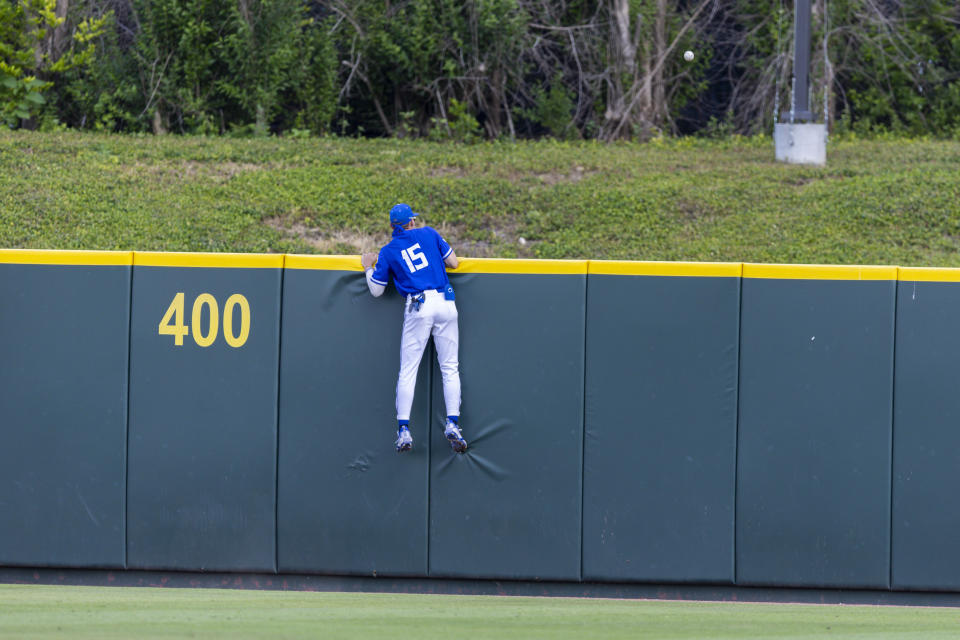 Indiana State outfielder Seth Gergel watches as a two-run home run by TCU's Cole Fontenelle flies over the wall in the third inning of an NCAA college baseball super regional game in Fort Worth, Texas, Friday, June 9, 2023. (AP Photo/Brandon Wade)