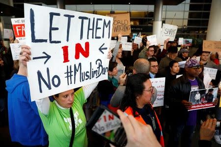 People protest Donald Trump's travel ban from Muslim majority countries at the International terminal at Los Angeles International Airport (LAX) in Los Angeles, California, U.S., January 28, 2017. REUTERS/Patrick T. Fallon