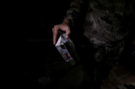 <p>A member of the Iraqi Army’s 9th Armoured Division holds a self-made bomb found inside a compound used as a prison by Islamic State militants in the 17 Tamuz (July 17) district, in western Mosul, Iraq, June 6, 2017. (Alkis Konstantinidis/Reuters) </p>