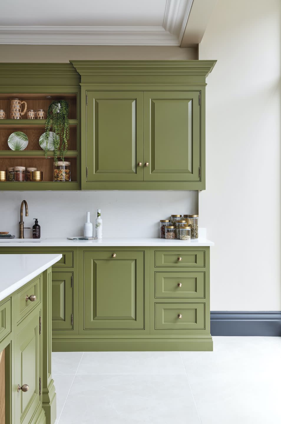 <p>Green kitchens are still having a moment in 2022.</p><p>'As a colour we associate primarily with nature, this grounding shade has an incredible way of reconnecting us with our surroundings, creating moments of calm and positivity,' says <a href="https://www.tomhowley.co.uk/" rel="nofollow noopener" target="_blank" data-ylk="slk:Tom Howley;elm:context_link;itc:0;sec:content-canvas" class="link ">Tom Howley</a>, Design Director at the eponymous kitchen company. </p><p>Ben Burbidge, Managing Director of <a href="https://burbidgekitchenmakers.co.uk/" rel="nofollow noopener" target="_blank" data-ylk="slk:Kitchen Makers;elm:context_link;itc:0;sec:content-canvas" class="link ">Kitchen Makers</a>, agrees that we'll continue to a surge in popularity of green finishes: 'A positive and versatile colour it can be used in deep, rich saturated tones to deliver a luxury look, especially when combined with marble worktops and brass detailing. At the other end of the scale softer, more powdery tones are particularly efficient in delivering the aspirational country kitchen look.'</p><p>Pictured: The Devine Collection in Serpentine, <a href="https://www.tomhowley.co.uk/kitchens/elegant-green-shaker-kitchen/" rel="nofollow noopener" target="_blank" data-ylk="slk:Tom Howley;elm:context_link;itc:0;sec:content-canvas" class="link ">Tom Howley</a></p>