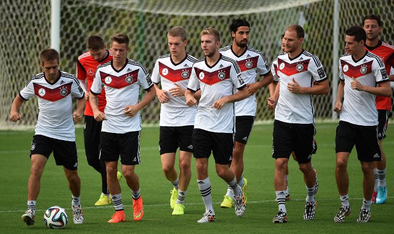 Germany's players warm up during a training session in Santo Andre on July 10, 2014