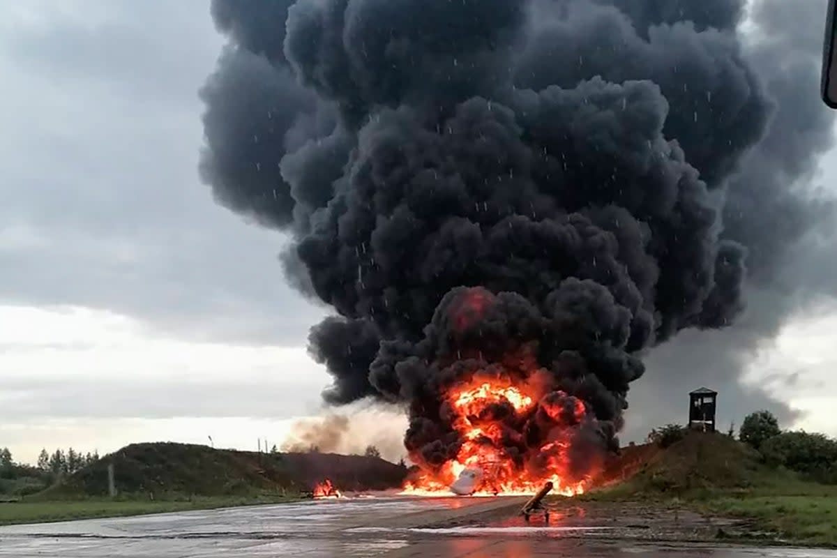 A Russian warplane burning on the Soltsy air base in the Novgorod region in northwestern Russia in images from social media (Sirena Telegram channel via AP)