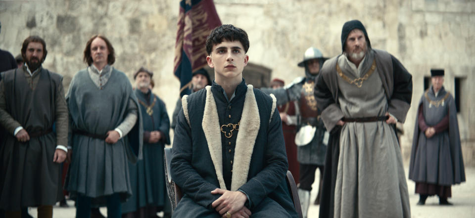 This image released by Netflix shows Timothée Chalamet, center, in a scene from "The King." (Netflix via AP)