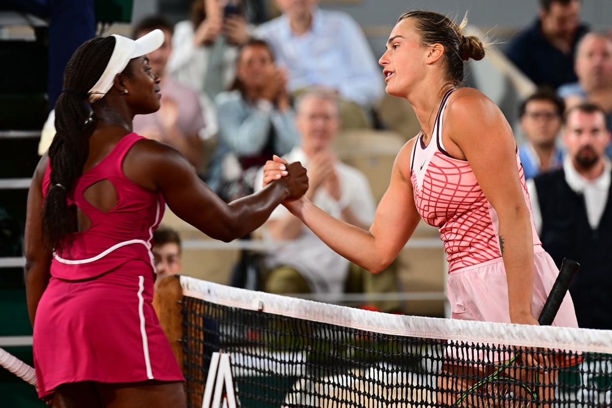 Belarus' Aryna Sabalenka (R) shakes hands with US Sloane Stephens after her victory during their women's singles match on day eight of the Roland-Garros French Open tennis tournament at the Court Philippe-Chatrier in Paris on June 4, 2023. (Photo by Emmanuel DUNAND / AFP) (Photo by EMMANUEL DUNAND/AFP via Getty Images)