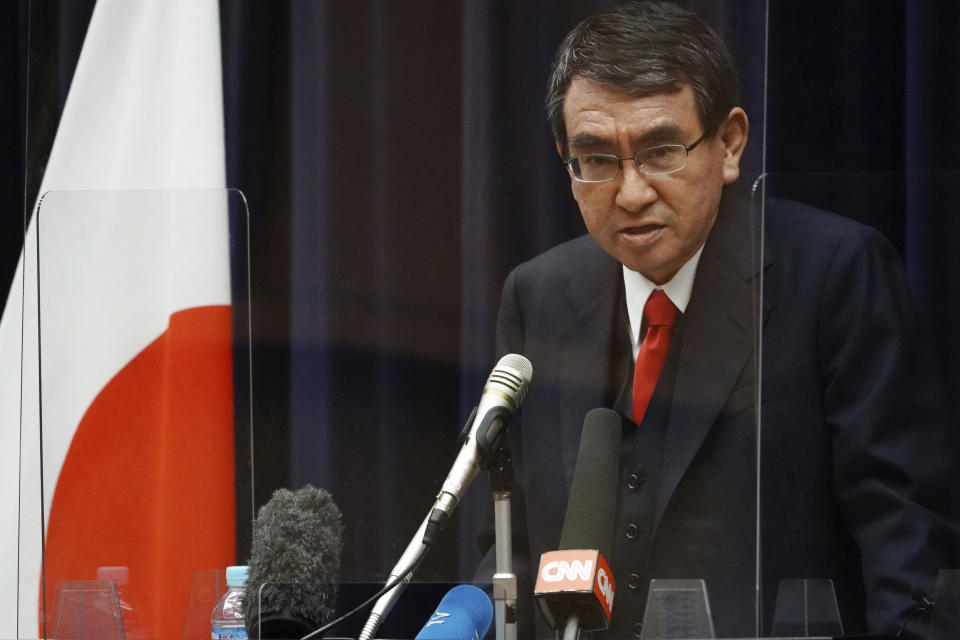 Japan's Administrative Reform Minister Taro Kono, who is also in charge of COVID-19 vaccines, speaks during a press conference ahead of COVID-19 inoculation Tuesday, Feb. 16, 2021, in Tokyo. Japan’s COVID-19 vaccinations are scheduled to begin Wednesday. (AP Photo/Eugene Hoshiko)