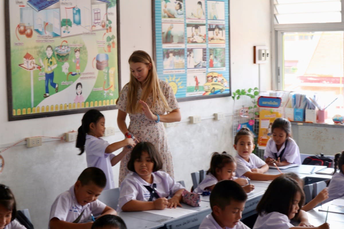 Caroline Bradner with her students in Thailand before she became ill. (Photo: GoFundMe)