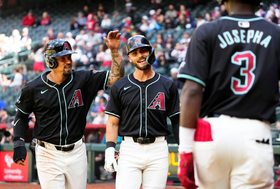 Arizona Diamondbacks Blaze Alexander (center) reacts after hitting a two-run home run against the Cleveland Guardians in the fourth inning during a spring training game at Chase Field in Phoenix on March 26, 2024.